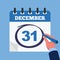 Mark on the calendar at 31 december. Close-up businessman hand with calendar and blue marker.