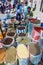A market stall with a variety of spices, herbs and nuts for sale at the Indian market in Otavalo in Ecuador.