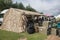 Market stall vendor at an outdoor festival with army surplus ex military items for sale