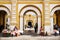 Market stalls in front of El Calvario entrance in Antigua, Guatemala