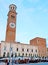 The market stalls in front of Palazzo Ragione palace in Piazza Erbe square, Verona, Italy