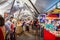 Market stalls under canvas awnings in The Rocks, Sydney Harbour, Sydney, Australia