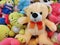 Market store sells different kinds of soft toys, teddy bears, dolls, puppets