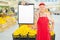 Market vendor holding clipboard in a supermarket