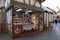 Market vendor stall selling Christmas fragrances and gifts in an outdoor market setting