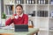 Marketing, Finance, Accounting, Planning, A female accountant holds a coffee cup and uses a laptop computer and documents, charts