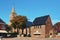 Marketplace in city center of town Den Burg with old brick stone buildings and protestant church with clock tower