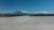 Marking lines and tire tracks are visible on the concrete runway of the airfield.