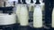 Marking milk bottles at food factory. Dairy industry. Food plant. Milk factory