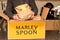 Marley Spoon cardbord box with meal kits open on a kitchen counter. Australian subscription delivery