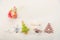 Marmalade inside wine glass and christmas ornaments on white textured background