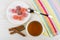 Marmalade in saucer, teaspoon, cinnamon, tea, napkin on table