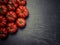 Marmande tomatoes on slate background