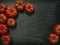 Marmande tomatoes on slate background