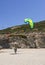 Marmari, Evia island, Greece. August 2020:  An instructor trains a girl to operate a kite parachute on the beach of the Greek isla