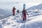 Marmaros, The Carpathians, UKRAINE - FEB 15 2021: An active female freerider with a team hikes on a winter trail in a backcountry