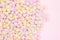 Marmellow air marshmallow close-up on a pink background, pastel colors, light dessert, place for text