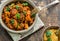 Maroccan lamb tajine with couscous garnished with fresh coriander leaves