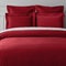 Maroon color bed sheets and pillows