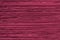 Maroon fabric with fringe. Close-up. Background