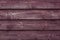 Maroon wood texture background. Vinous wooden plank surface. Burgundy wooden shabby table, fence, barn. Abstract pattern of red lu