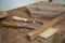 Marquetry tools for carver on wooden plank