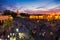 MARRAKECH, MOROCCO - APR 29, 2016: Sunset view on the Koutoubia mosque and Djemaa el Fna square with people in Marrakesh