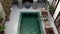 MARRAKESH, MOROCCO - OCTOBER 2019: Top view of swimming pool in courtyard in luxurious Moroccan riad with architecture