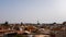 Marrakesh skyline with tower Mosque landmarks from a rooftop on a blue sky
