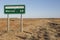 Marree Oodnadatta Track signage with bullet holes roadside in the outback of Australia