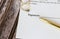 Marriage contract with two golden wedding rings and gold pen, prenuptial agreement, macro close up, sign with signanture,document,