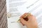 Marriage contract with two golden wedding rings and gold pen, prenuptial agreement, macro close up, sign with signanture,document,