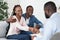 Marriage Counselling Concept. Grateful Black Couple Shaking Hands With Therapist After Session