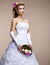 Marriage. Fashionable Bride Blonde in Bridal White Dress and Unusual Bouquet of Flowers