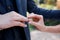 Marriage hands with rings. birde wears the ring on the finger of the groom