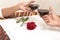 Marriage proposal. Engaged couple holding red wine glass