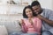 Married black couple happy with positive results of pregnancy test