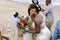 Married Black woman holding flowers