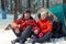 a married couple of active tourists on the nature in a winter forest in a hike