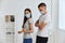 married couple with bactericidal plasters on their shoulders in the hospital medical mask covid passport