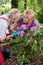 Married couple caring about flowers