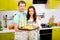 Married couple cooking apple pie at the kitchen at home