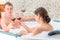 Married couple with glasses of wine in the jacuzzi