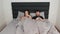Married couple lies in bed using smartphones. Couple Of spouses lying on bed And watching at smartphones. Communication in socialY