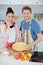 Married couple making apple pie on kitchen