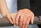 Married couple shows wedding rings