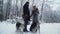 A married couple walks with huskies keeping them on a leash in a winter park. Playful dogs having fun walking outdoors.