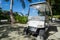 A Marriott Bonvoy golf cart waits is available to transport resort guests around