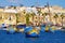 MARSAXLOKK, MALTA - 11. NOVEMBER 2019: View on the harbour with colorful boats luzzi in Marsaxlokk, Malta
