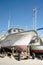 Marsaxlokk, Malta, August 2019. A fishing boat on the shore against a blue sky.